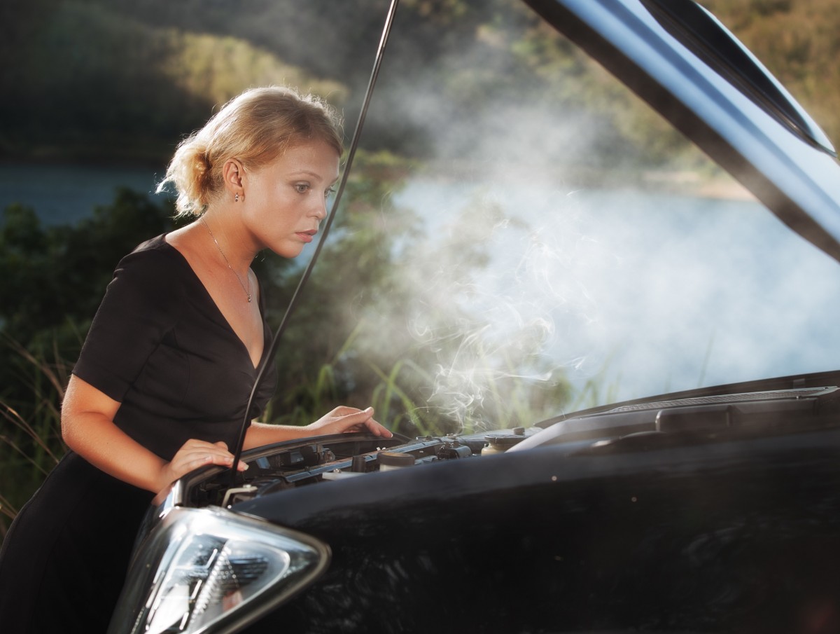 Lady with car hood up - steam rising