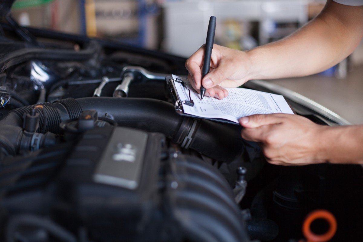 mechanic taking notes